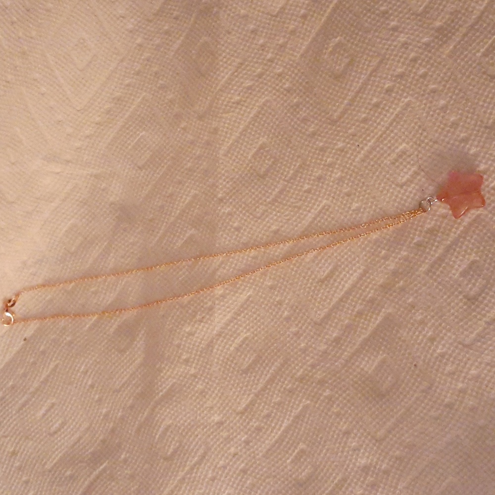 Pink star pendant on rose chain
